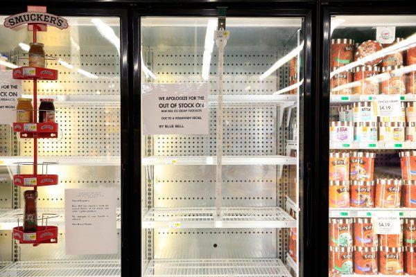 Shelves are bare and signs are posted where Blue Bell products were displayed in a grocery store on April 21 in Overland Park, Kansas. (Jamie Squire/Getty Images)