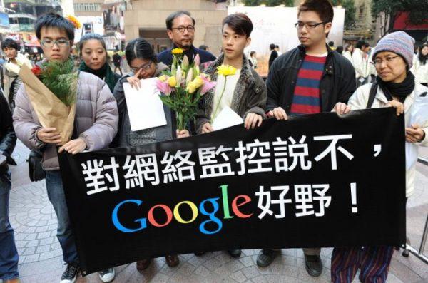 A group of Google users holds a banner to wish Google well in Hong Kong, Jan. 14, 2010, after Web giant Google announced it might pull out of China following cyber-attacks on its Web site. The banner reads, "Say no to internet censorship - Google well done!" (Mike Clarke/AFP/Getty Images)