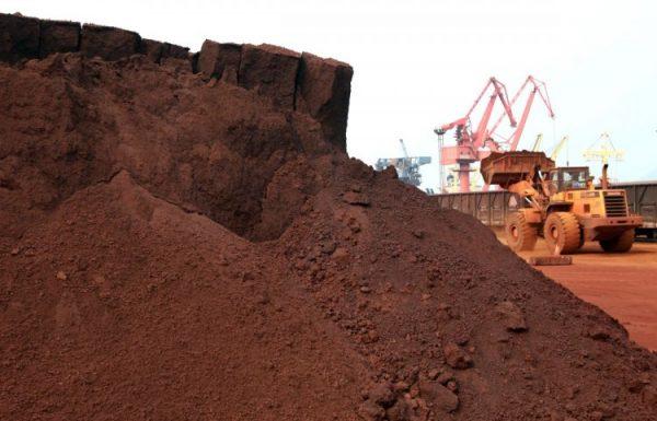 A machine shifts soil containing rare earth minerals to be loaded for export in Lianyungang City, Jiangsu Province, on Sept. 5, 2010. (STR/AFP/Getty Images)