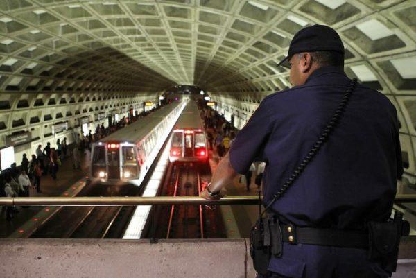 A Metro Transit police officer watches DC Metro trains in Washington, D.C. on Oct. 27. 2010. (Alex Wong/Getty Images)