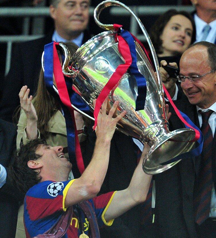 Barcelona's Argentinian forward Lionel Messi celebrates with the trophy at the end of the UEFA Champions League final football match FC Barcelona vs. Manchester United, at Wembley Stadium in London on May 28, 2011. (Carl De Souza/AFP/Getty Images)