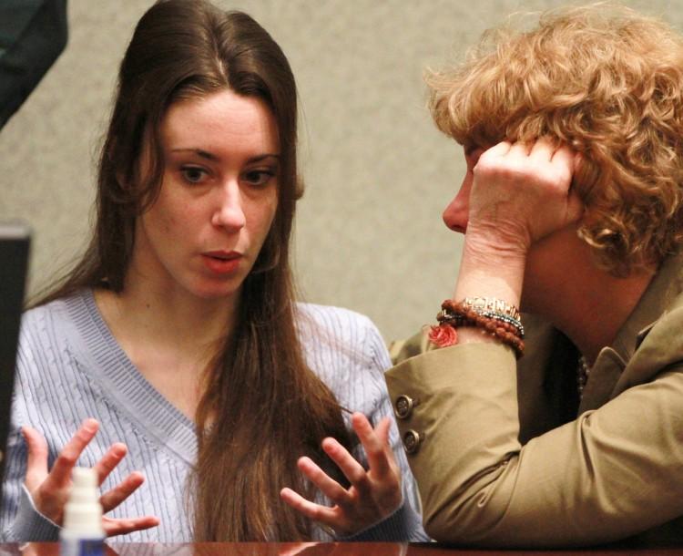 Casey Anthony talks with her attorney Dorothy Clay Sims at her sentencing hearing on charges of lying to a law enforcement officer at the Orange County Courthouse July 7, in Orlando, Florida. (Joe Burbank-Pool/Getty Images)
