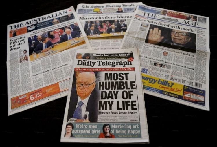 Australian newspaper front pages displayed in Sydney on July 20 detail the results of the appearance of Rupert Murdoch and his son James Murdoch at a parliamentary committee hearing in London. (Greg Wood/AFP/Getty Images)