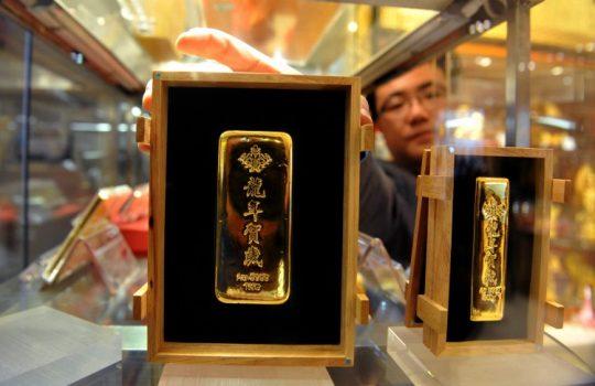 Bars of 2012 Lunar New Year gold are displayed in Beijing, Nov. 25. (STR/AFP/Getty Images)