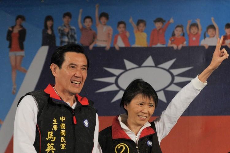 Then-Taiwan President of the ruling Kuomintang Party Ma Ying-jeou and his wife Chou Mei-ching smile as they step on stage after voting results showed that he won the election at his campaign headquarters in Taipei on Jan. 14, 2012. (Aaron Tam/AFP/Getty Images)