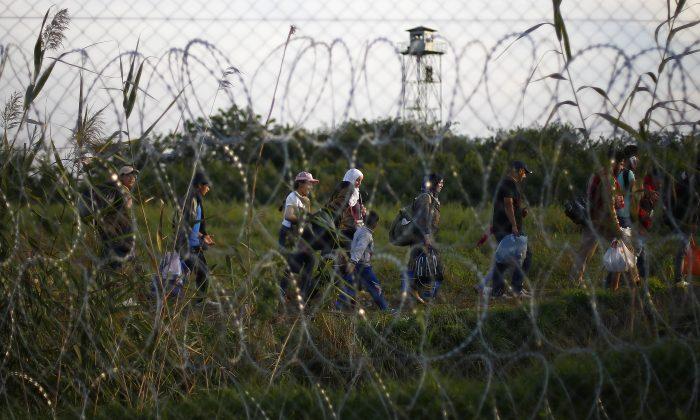 Razor-Lined Boxcar Marks Hungary’s New Border for Migrants