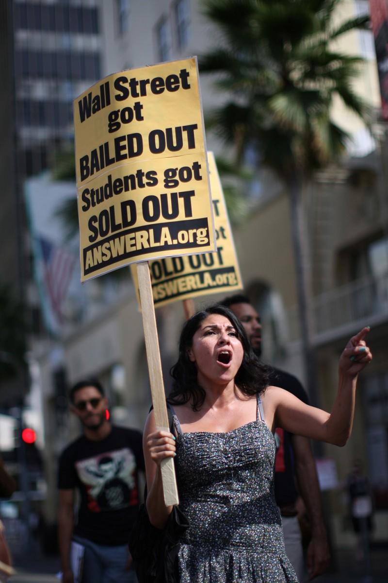 Students protest the rising costs of student loans for higher education on Hollywood Boulevard in Los Angeles, Sept. 22, 2012. Citing bank bailouts, the protesters called for student loan debt cancelations. (David McNew/Getty Images)