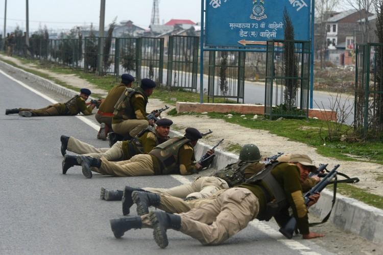 Indian paramilitary personnel take up positions outside a school after an attack against Indian paramilitary personnel in Srinagar, the summer capital of Jammu and Kashmir, on March 13, 2013. (TAUSEEF MUSTAFA/AFP/Getty Images)
