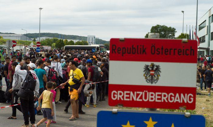 Joy as Migrants Flood Into Austria; Tears for Those Kept Out
