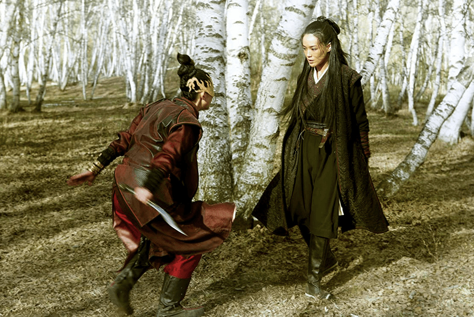 Two assassins (Ti-Ying Hsueh and Shu Qi) fight in a white birch forest, in "The Assassin." (Well Go USA)