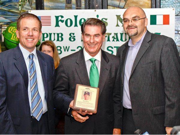 Steve Garvey (C) accepted a plaque and induction into the Irish American Baseball Hall of Fame at Foley's Pub on Tuesday. (Cliff Jia/The Epoch Times)