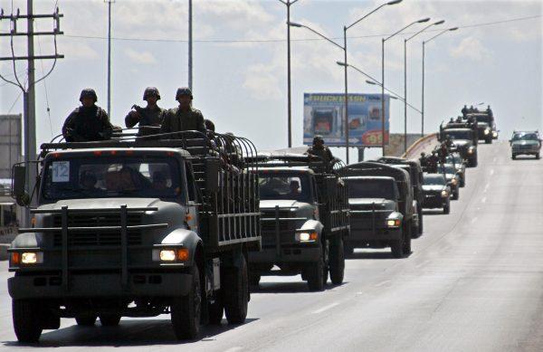 Members of the Mexican Army arrive to Ciudad Juárez in northern Mexico, on March 13, 2009. (Jesus Alcazar/AFP/Getty Images)