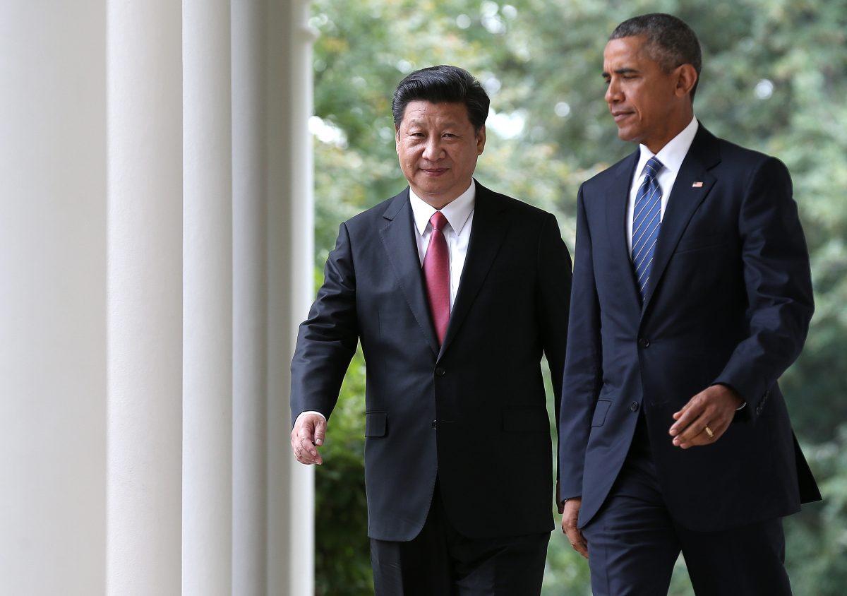 President Barack Obama (R) and Chinese leader Xi Jinping (L) arrive for a joint press conference in the Rose Garden at the White House in Washington on Sept. 25, 2015. (Win McNamee/Getty Images)