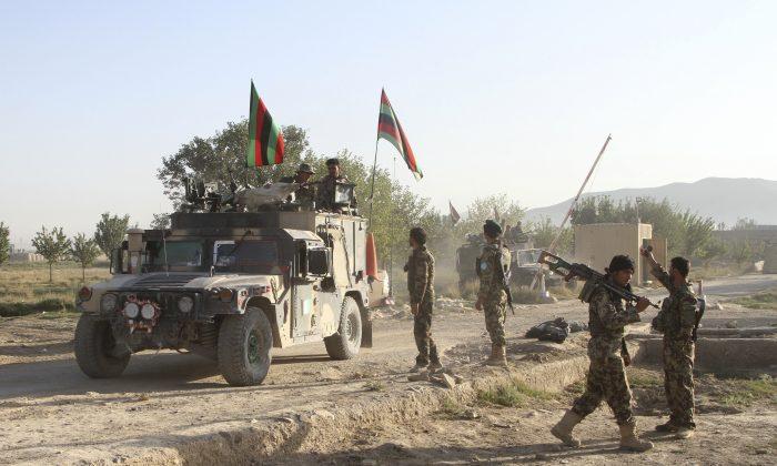 Taliban Display Force, Afghan President Vows to Retake City