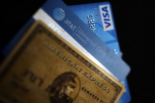 Credit cards are widening the gap between the rich and poor. A study says that credit cards often make the wealthy wealthier and those who are less fortunate more in debt. (Spencer Platt/Getty Images)