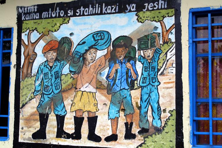 A picture deploring the recruitment of children painted by former child soldiers managed by UNICEF-partner CAJED in Goma, Democratic Republic of Congo. (Cornelia Walther/UNICEF DRC)