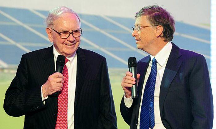 Warren Buffett (L), CEO of Berkshire Hathaway, and Bill Gates, founder of Microsoft, speak at the BYD auto manufacturer in Beijing on Sept. 29, 2010. (Frederic J. Brown/AFP/Getty Images)