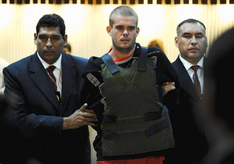 Joran van der Sloot is escorted by Peruvian police as he arrives at the Criminal Investigation Direction office in Lima on June 5.(Marcel Antonisse/Getty Images)