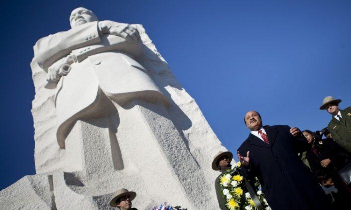 Martin Luther King III speaks at the base of a statue to his father after a wreath-laying ceremony at the Martin Luther King Jr. Memorial on the National Mall in Washington in this undated file photo. (Brendan Smialowski/Getty Images)