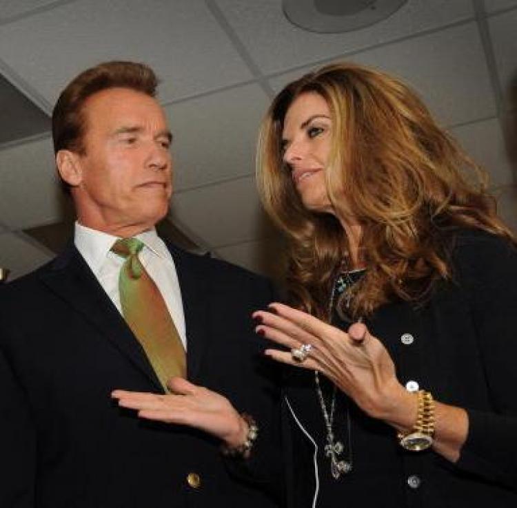 Arnold Schwarzenegger and his wife Maria Shriver during a Global Climate Summit this month in Los Angeles. California's first lady was photographed holding her cellphone to her ear while driving, violating a state's law signed by her husband. (Mark Ralston/AFP/Getty Images)