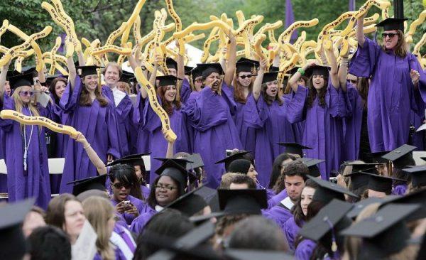 New York University graduates celebrate during commencement ceremonies on May 10, 2007. Some grads will be paying off student loans for years. (Mario Tama/Getty Images)