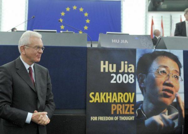 European Parliament President Hans-Gert Pottering poses next to the empty seat of Chinese dissident Hu Jia during the awards ceremony of the 2008 Sakharov Prize, on Dec. 17, 2008. (Dominique Faget/AFP/Getty Images)