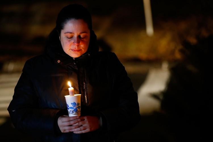 A mourner cries while visiting a memorial on Dec. 15, 2012, in honor of the victims of the Sandy Hook Elementary School shooting in Newtown, Conn. (Jared Wickerham/Getty Images)