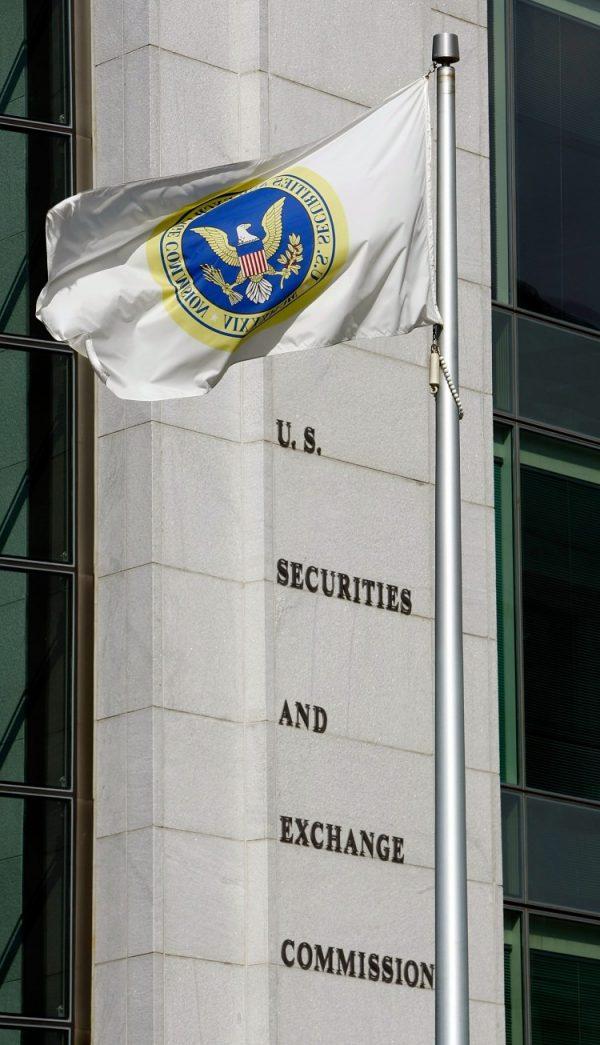 A flag flies in front of the U.S. Securities and Exchange Commission building in Washington, in this file photo. (Chip Somodevilla/Getty Images)