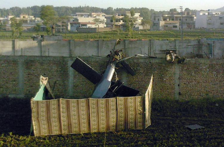 Stealth helicopter: A crashed military helicopter is seen near the hideout of al-Qaeda leader Osama bin Laden after a ground operation by U.S. Special Forces in Abbottabad, Pakistan, on May 2, 2011. (STR/AFP/Getty Images)