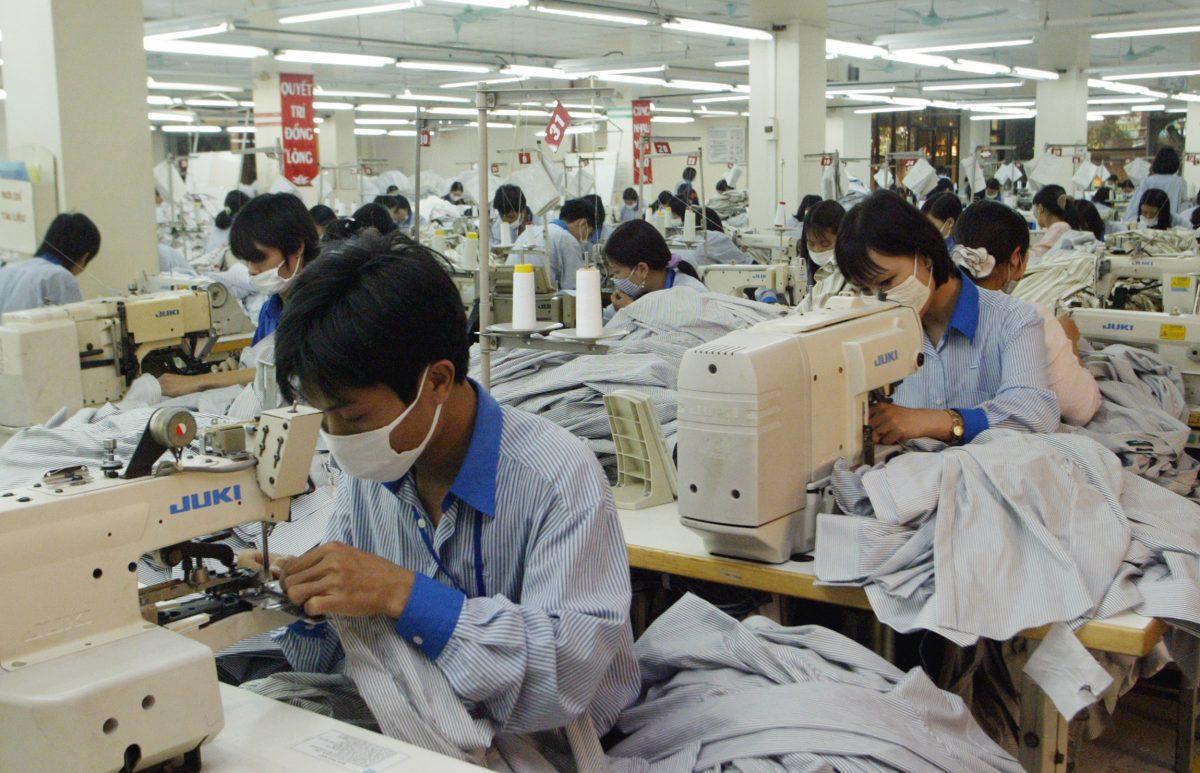 Chinese workers sew shirts to be exported to the United States at Garment Company 10 outside Hanoi, Vietnam, in this undated photo. (Tran Van Minh/AP Photo)