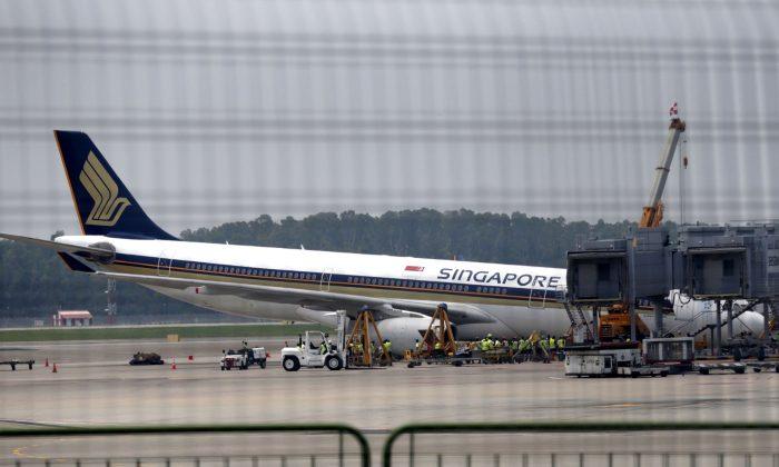 Singapore Airlines Jet Collapses During Checks, but No Injuries