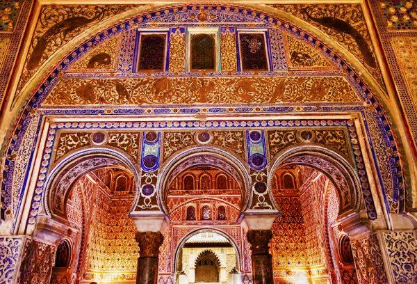 Horseshoe Arches in Ambassador Room in Alcazar Royal Palace Seville Andalusia Spain on Oct. 21, 2012. Originally Moorish Fort oldest Royal Palace in use in Europe. (Shutterstock)