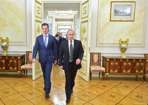 Russian President Vladimir Putin (R) and Syrian President Bashar al-Assad arrive for their meeting in the Kremlin in Moscow on Oct. 20, 2015. (Alexei Druzhinin/RIA-Novosti via AP)