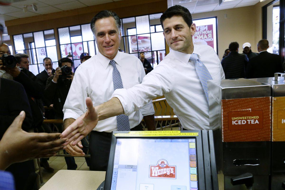 In this Nov. 6, 2012, file photo, then-Republican presidential candidate, former Massachusetts Gov. Mitt Romney and his vice presidential running mate, Rep. Paul Ryan, R-Wis., make an unscheduled stop at a Wendy's restaurant in Richmond Heights, Ohio. (AP Photo/Charles Dharapak, File)