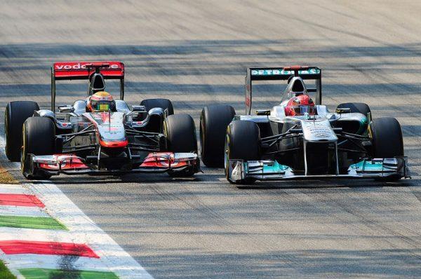 Michael Schumacher (R) battles Lewis Hamilton (L) during the Formula One Italian Grand Prix at the Autodromo Nazionale di Monza in Monza, Italy on Sept. 11, 2011. (Giuseppe Cacace/AFP/Getty Images)