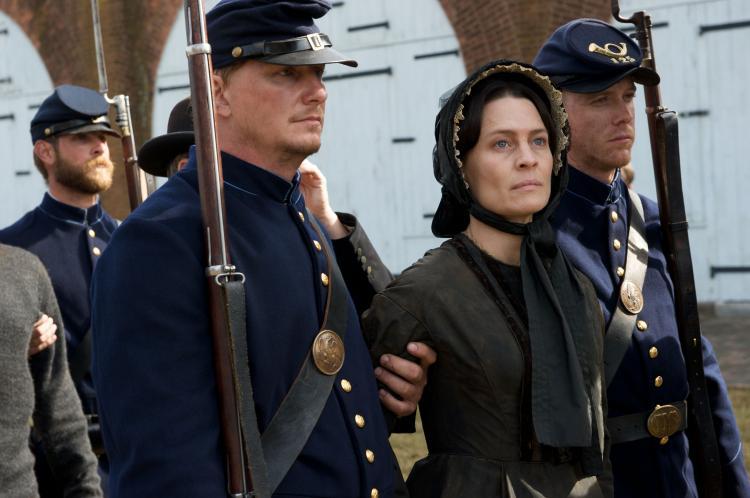 Mary Surratt (Robin Wright) being escorted by military agents, in "The Conspirator." (Roadside Attractions)