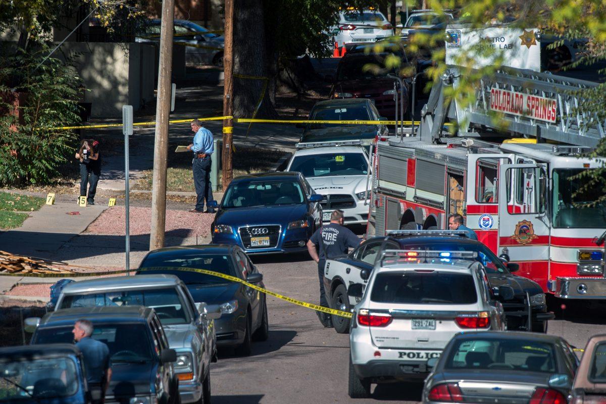 Police investigate the scene after a shooting in Colorado Springs, Colo., on Oct. 31, 2015. (Christian Murdock/The Gazette via AP)