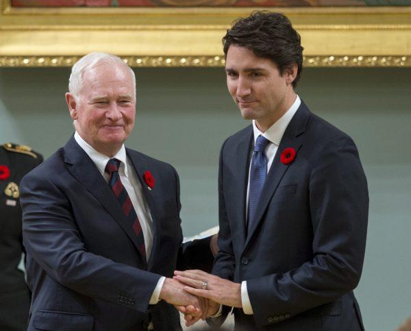 Prime Minister Justin Trudeau shakes hands with then-Governor General David Johnston after being sworn in as prime minister of Canada at Rideau Hall in Ottawa on Nov. 4, 2015. (Justin Tang/The Canadian Press via AP)