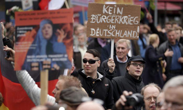 Berlin Protesters Criticize Merkel on Refugees