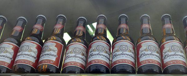 Bottles of Budweiser beer in a shop window in London on Oct. 13, 2015. Like Bud Light, Budweiser has also seen a recent drop in sales. (Kirsty Wigglesworth/AP Photo)