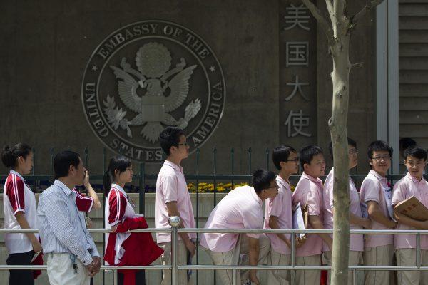 Chinese students wait outside the U.S. Embassy for their visa application interviews in Beijing, in this undated photo. (Alexander F. Yuan/AP Photo)
