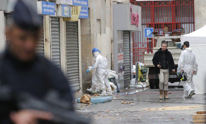 Officials: Suspected Paris Mastermind, Cousin Died in Raid