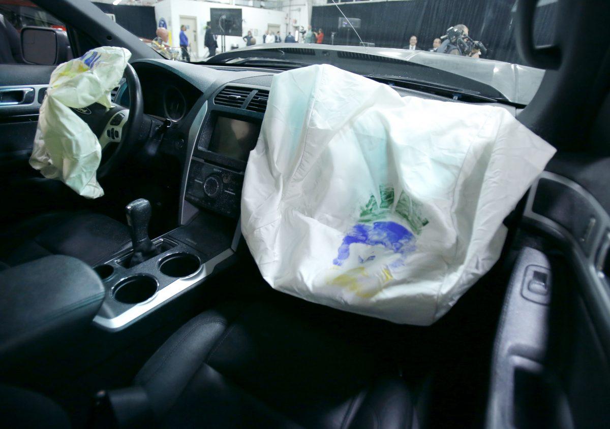 Airbags in a 2014 Ford Explorer show where paint, that is applied to the face of a full-scale anthropomorphic test device, transferred to the airbag during a crash test at Ford Motor Company's Dearborn Development Center Monday, March 10, 2014, in Dearborn, Mich. (AP Photo/Duane Burleson)