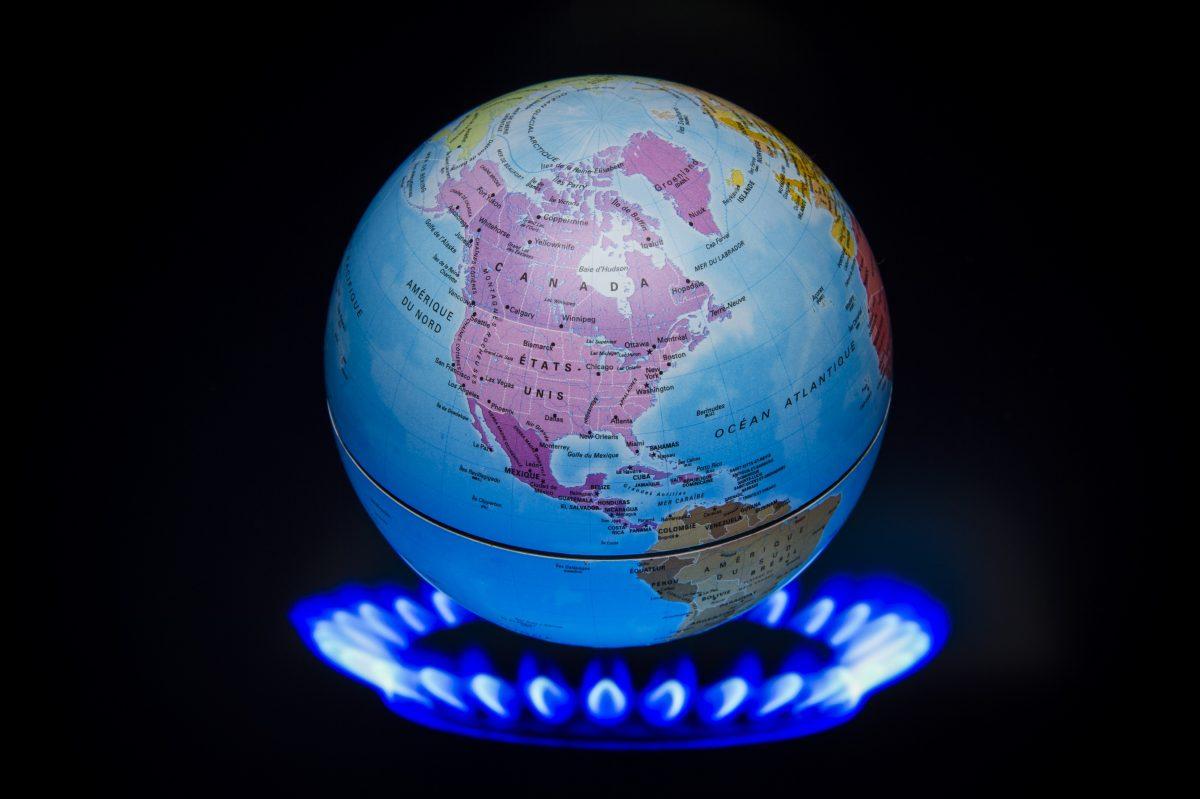 A small globe above a fire to illustrate global warming is seen during the 21st Session of the Conference of the Parties to the U.N. Framework Convention on Climate Change in France on Nov. 4, 2015. (Lionel Bonaventure/AFP/Getty Images)