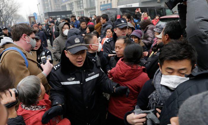 Lawyer on Trial in Beijing as Police Scuffle With Protesters
