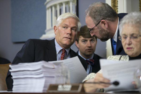 House Rules Committee Chairman Pete Sessions (R-Texas) (L), with Rep. Virginia Foxx (R-N.C.) (R), confers with staff at the Capitol in Washington, D.C., on Dec. 16, 2015. (AP/J. Scott Applewhite)