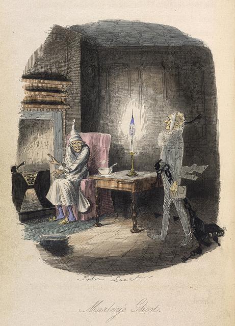 Ebenezer Scrooge is visited by Marley’s ghost, from the 1843 edition of "A Christmas Carol." In the updated version, Scrooge's modern-day counterpart is named Karol Charles. (The British Library)