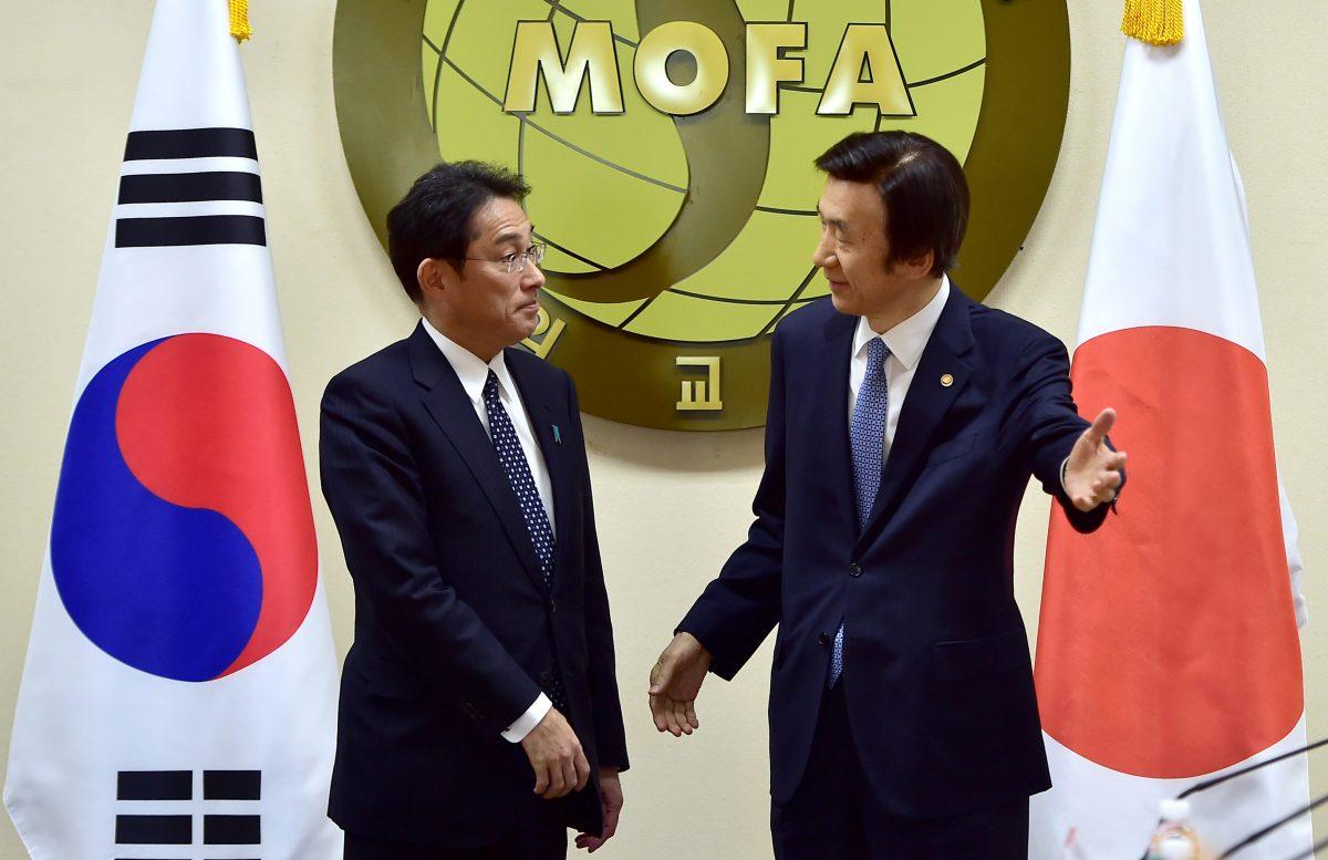 South Korean Foreign Minister Yun Byung-Se, right, ushers his Japanese counterpart, Fumio Kishida, at the start of their meeting at Foreign Ministry in Seoul, South Korea, on Dec. 28, 2015. The foreign ministers met to try to resolve a decades-long impasse over Korean women forced into Japanese military-run brothels during World War II. (Jung Yeon-je/Pool Photo via AP)