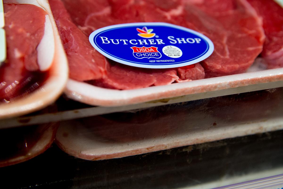 Packages of beef and pork are seen on a rack in a file photo. (AP Photo/Andrew Harnik)