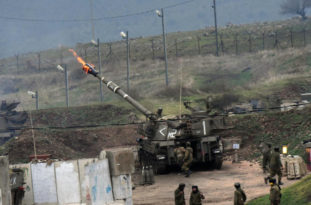 The Israeli army fire artillery shells into Lebanon, following a bomb attack by Lebanon's Hezbollah movement targeting an Israeli army border patrol in the disputed Shebaa Farms area along the Lebanon-Israel ceasefire line on Jan. 4, 2016. Hezbollah said it had targeted an Israeli army border patrol with a bomb in an attack that prompted retaliatory fire from the Jewish state. (Avihu Shapira/AFP/Getty Images)